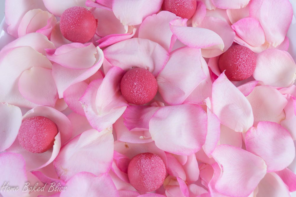 Rose water truffles on a bed of rose petals.