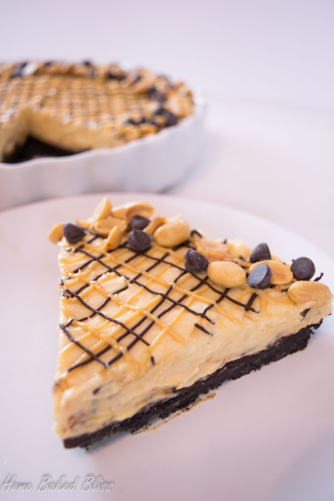 A slice of peanut butter chocolate pie on a white plate.