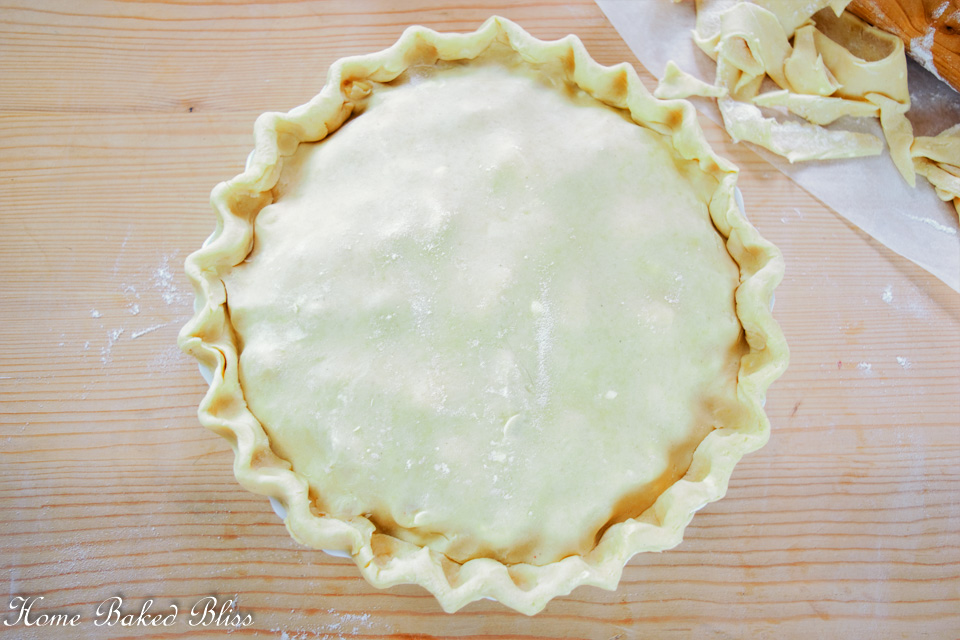 A gluten free pie with crimped edges.