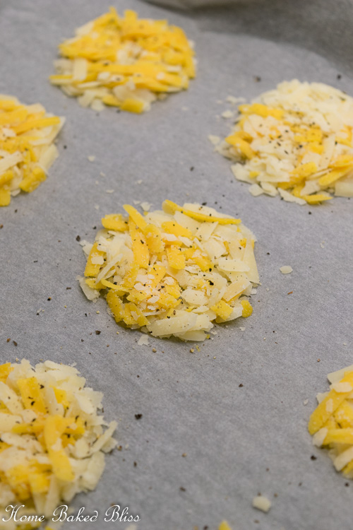 Cheese crackers on parchment paper.
