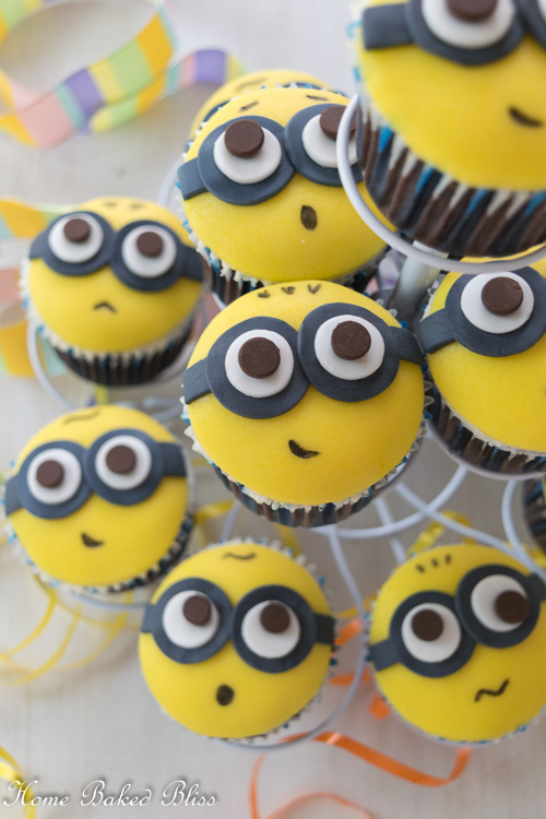 Minion Cupcakes on a white cupcake stand