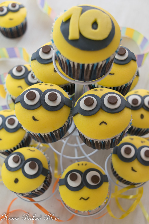 Minion Cupcakes on a white cupcake stand