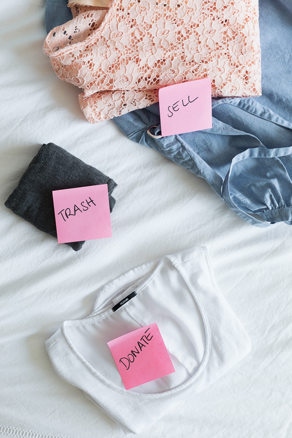 Sorting clothes in 3 categories with sticky notes