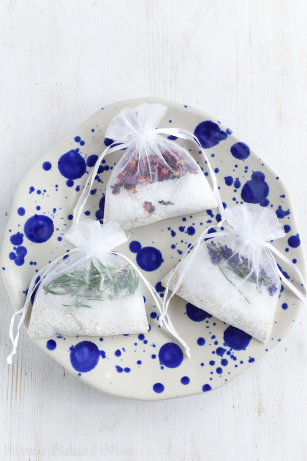 Tub tea sachets filled with salts, oat flour and dried flowers and herbs