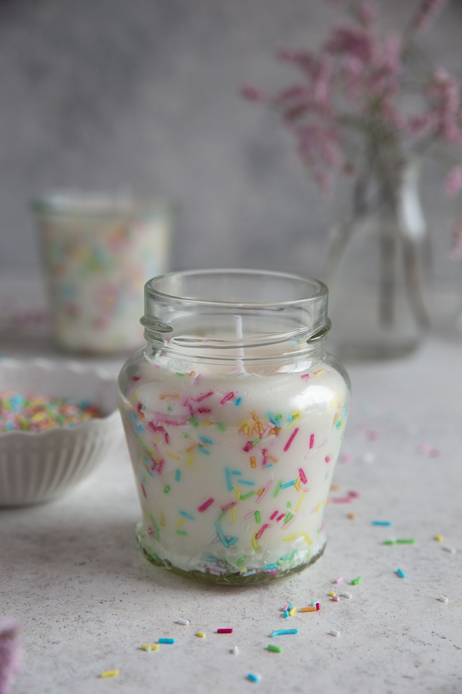 A funfetti candle on a white background