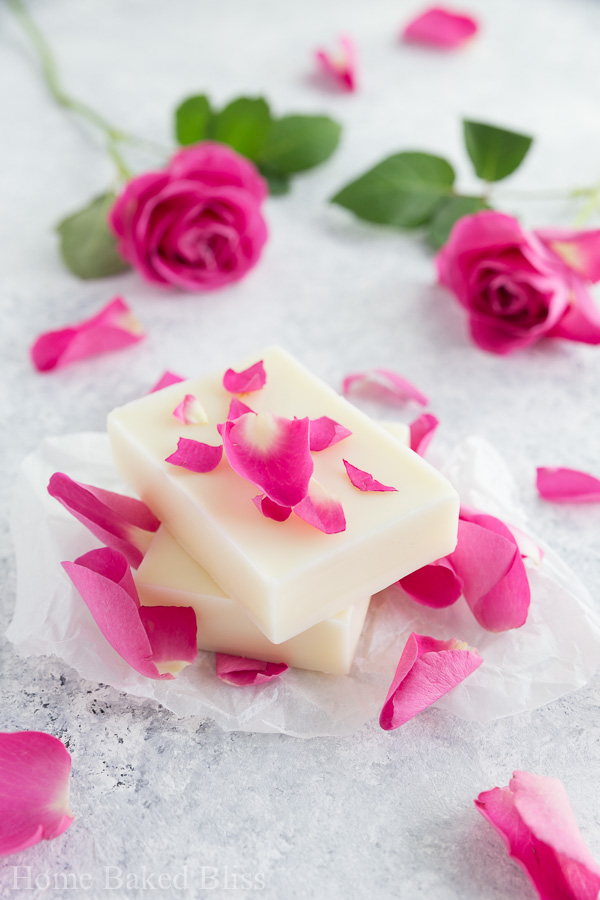 Easy diy rose lotion bars that are incredibly hydrating and suited for sensitive skin. Made with Shea butter and rose essential oil. Makes a gorgeous gift!