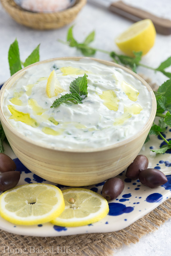 A bowl of Greek tzatziki drizzled with olive oil.