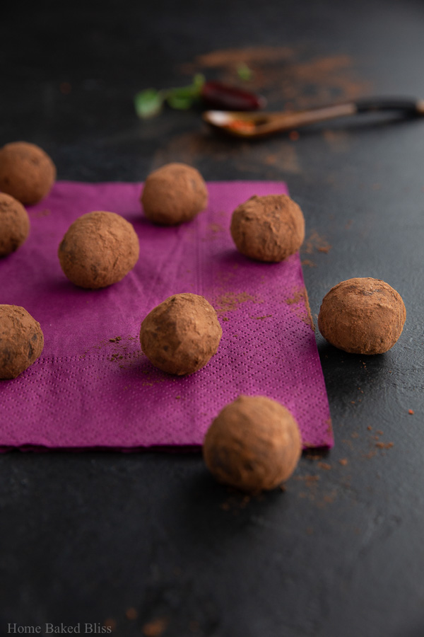 Spicy chili truffles on a violet napkin.
