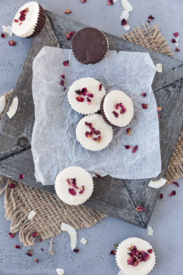 Vegan rose infused chocolate cups on white parchment paper