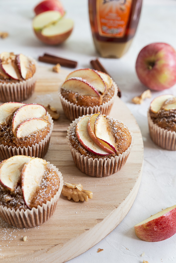 A closeup of apple walnut muffins sweetened with honey and garnished with apple slices