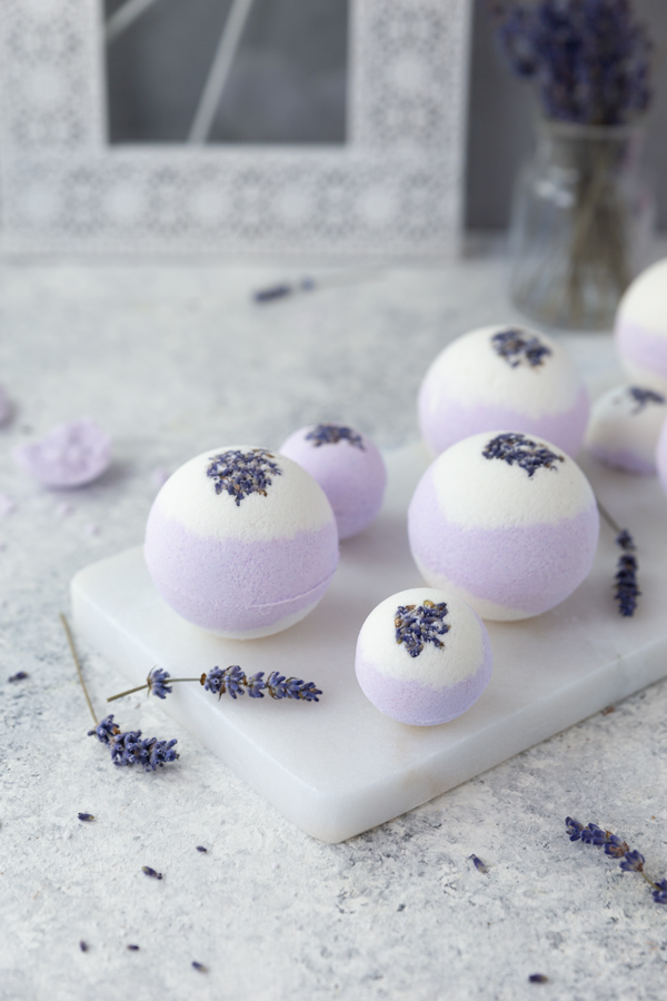 Two toned lavender bath bombs on marble tray