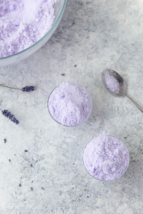 Overfilling the bath bomb molds with violet mixture