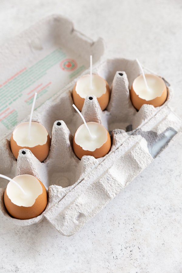 Letting the wax harden in the eggshells