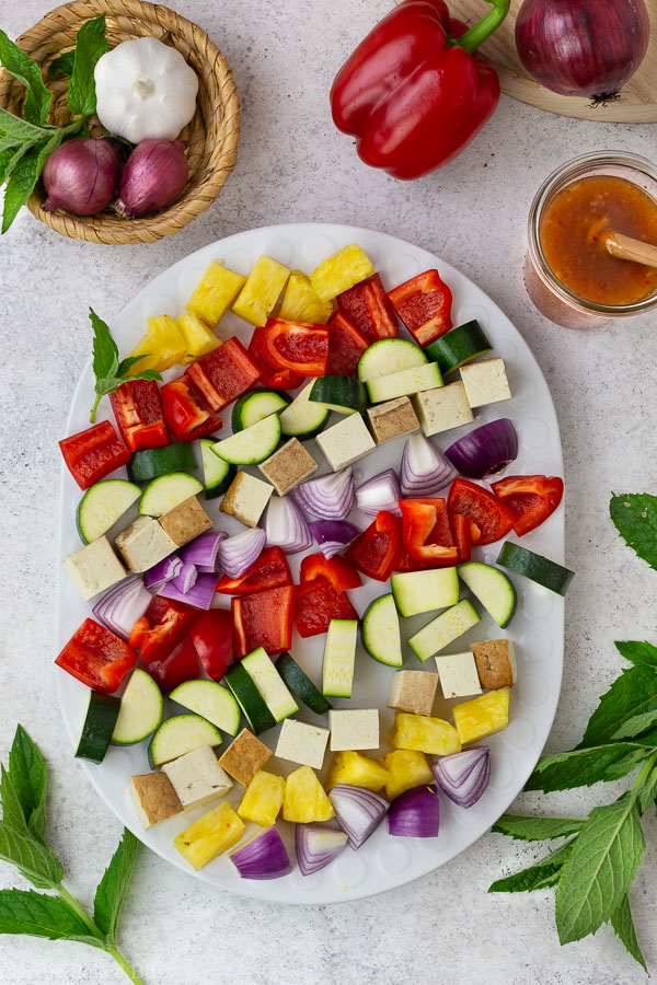 Colourful chopped veggies on a white plate