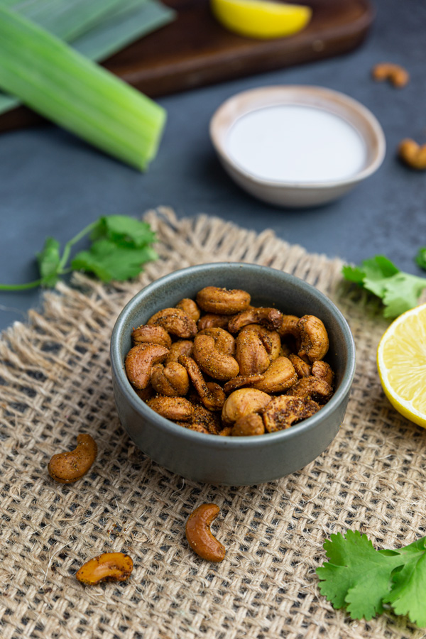 Crunchy curried cashews in small bowl