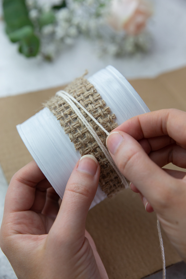 Wrapping cotton yarn around the DIY flower pots