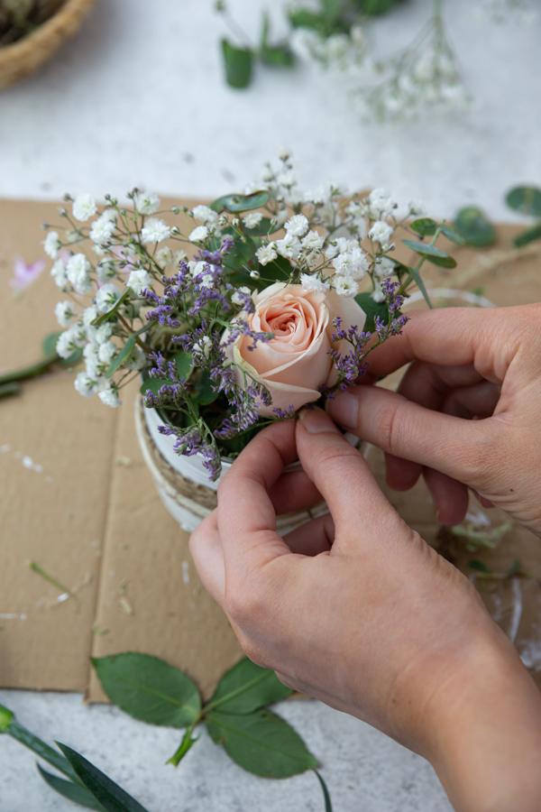 Adding flowers into the floral foam