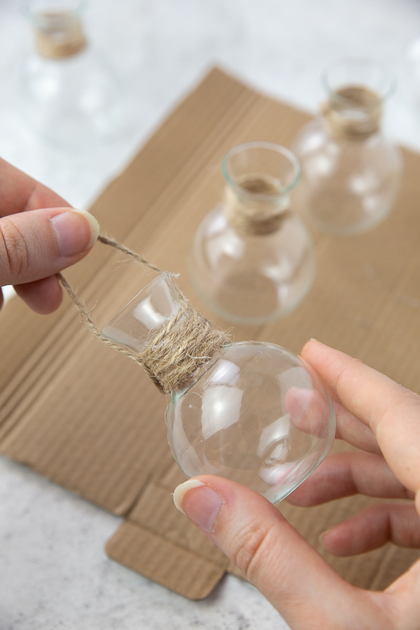 Tying string around the glass vases