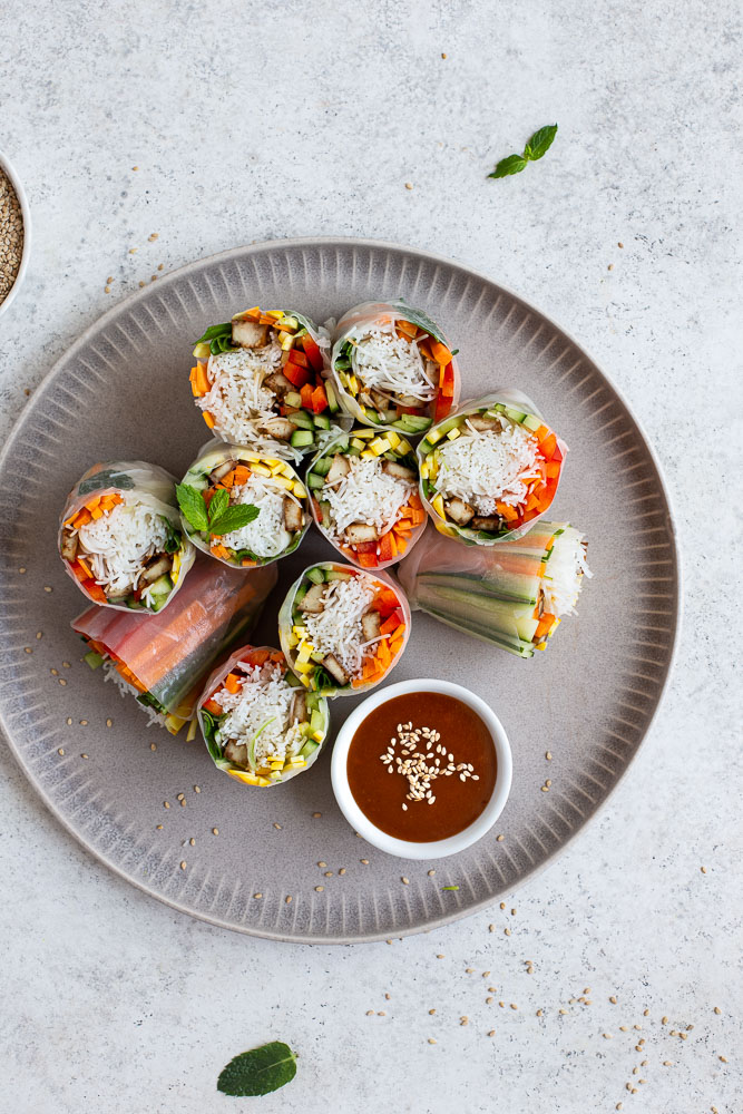 Vegan rice paper rolls on a large plate