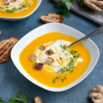 Creamy vegan carrot coconut soup with croutons