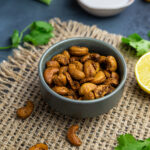 Crunchy curried cashews in small bowl