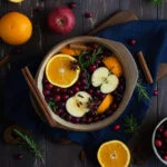 Autumn stovetop potpourri with oranges, apples, rosemary and cinnamon