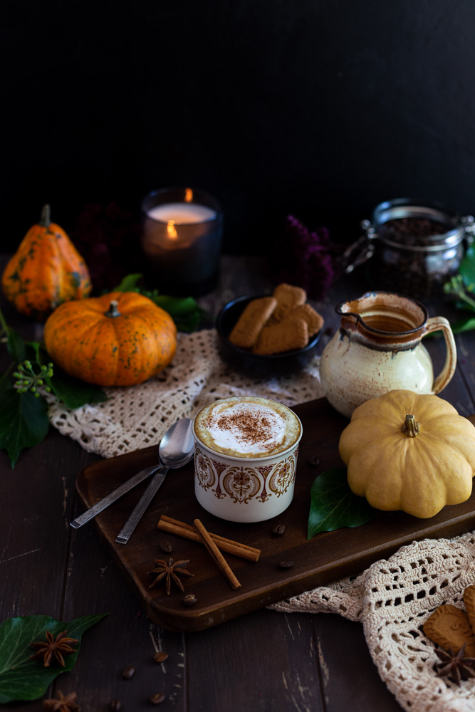 Vegan Pumpkin Spice Latte with Cinnamon on a wooden plate