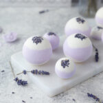 Two toned lavender bath bombs on marble tray