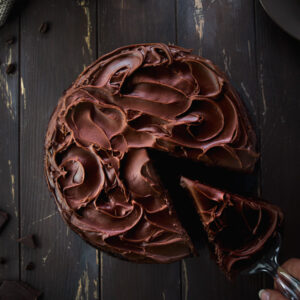 Serving a slice of vegan chocolate cake