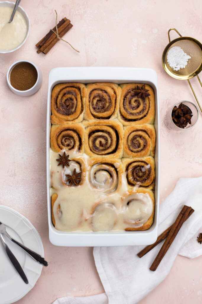 Vegan chai Spiced Rolls frosted with cream cheese frosting