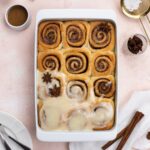 Vegan chai Spiced Rolls frosted with cream cheese frosting