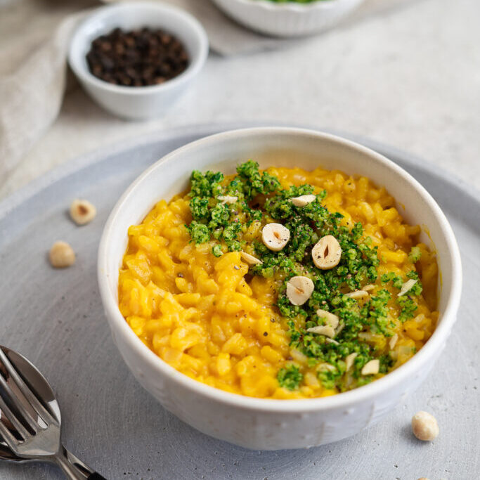 Carrot Risotto with a hazelnut Gremolata topping on a stone tray